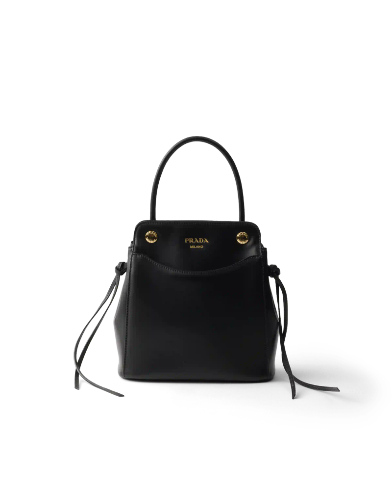 PRADA CARRY BAG FALL WINTER 2026 image of the Prada Carry bag from the Fall Winter 2026 collection. The accessory features soft calfskin leather and front pockets.