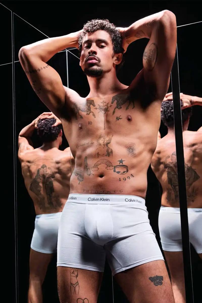 Calvin Klein Bad Bunny wearing Calvin Klein underwear from the Icon Cotton Stretch line, photographed in Puerto Rico.