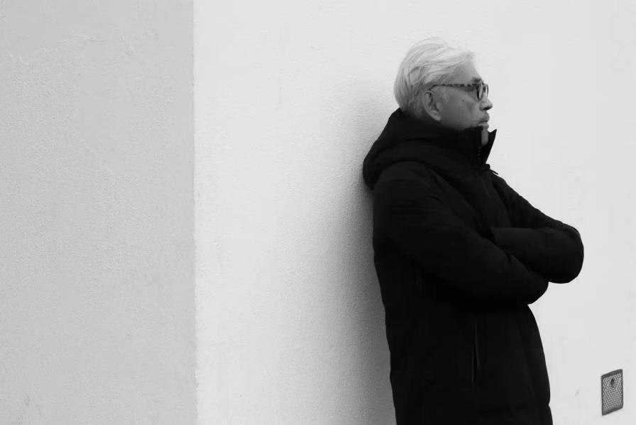 An immersive museum exhibition exploring the life and work of Ryuichi Sakamoto, featuring large-scale multimedia installations that blend music, visual art, and spatial design. The exhibition showcases Sakamoto's creative journey across multiple artistic disciplines, highlighting his contributions to electronic music, film scoring, and visual arts through interactive and sensory experiences.