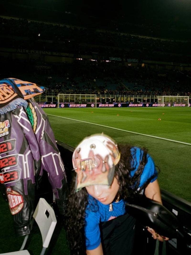 image about DJ HoneyLuv at the Inter Milan match in Milano discussing her career and new single.