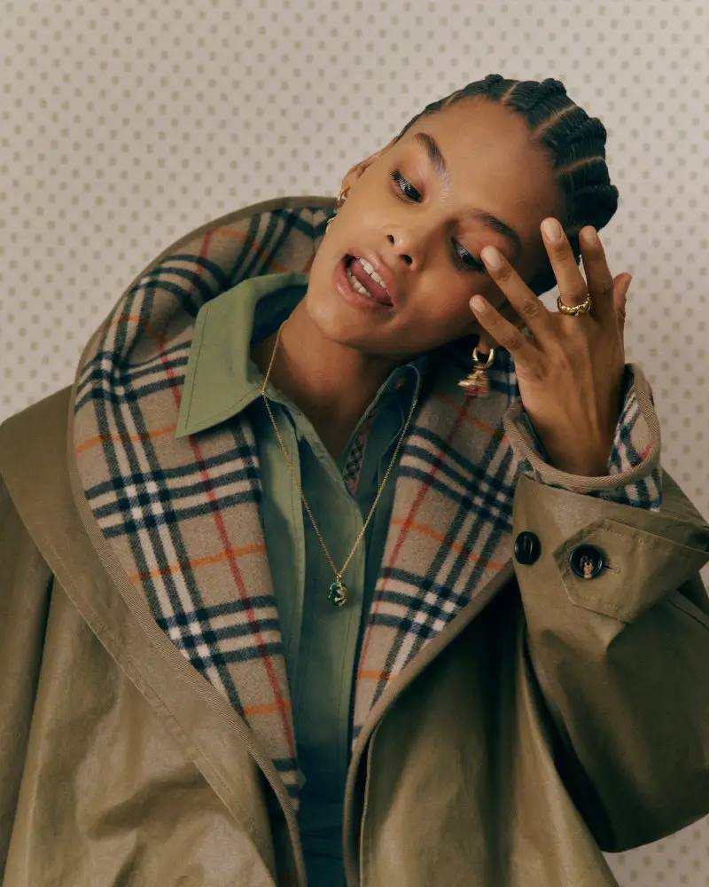 BURBERRY RETURNS TO HOUSE CODES FOR SPRING 2026 Article reviewing Burberry's Spring 2026 menswear collection, featuring heritage-inspired pieces including trench coats, knitwear, and accessories with signature house patterns.