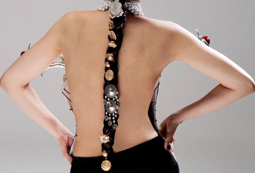 Actress Elvira Devinamira models the clothing to represent cultural duality.