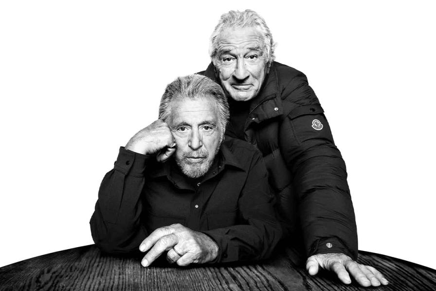 MONCLER AD CAMPAIGN REUNITES DE NIRO AND PACINO Black and white portraits of actors Al Pacino and Robert De Niro wearing Moncler outerwear for the Warmer Together campaign.