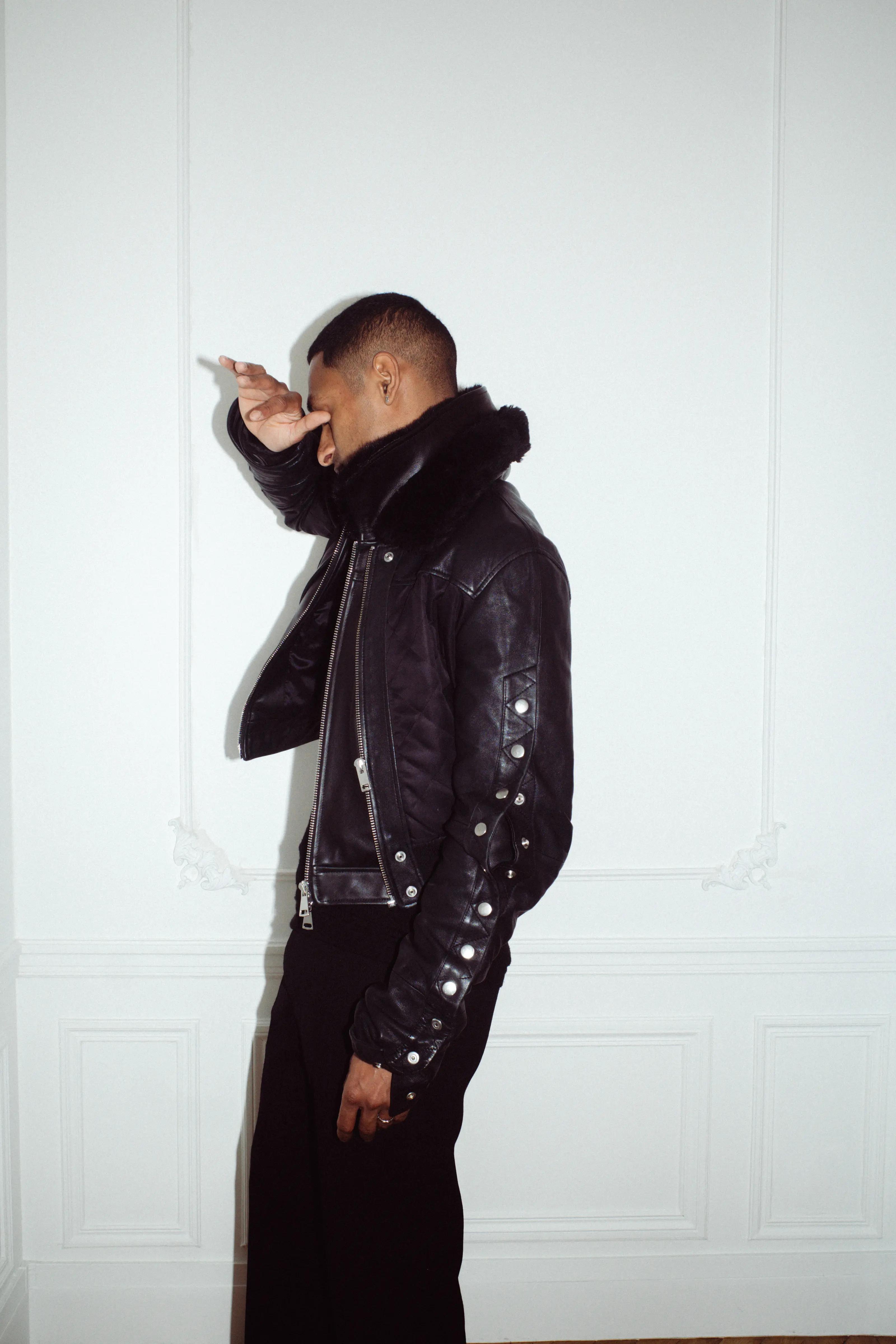 icykof shoot & interview in Paris with casawi magazine, wearing leather jacket and On running beanie. photography by Lorenzo Bonanni