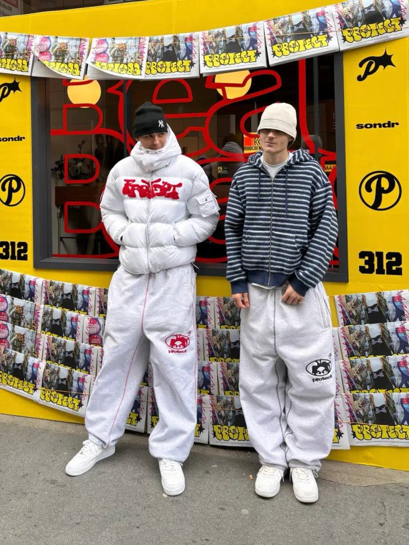 An in-depth interview with Peter and Egor, founders of streetwear brand Protect LDN, discussing their friendship-based business partnership, creative process, brand evolution, and perspectives on fashion trends and sustainability. The article explores their journey from making clothes they wanted to wear to building a community-focused brand.