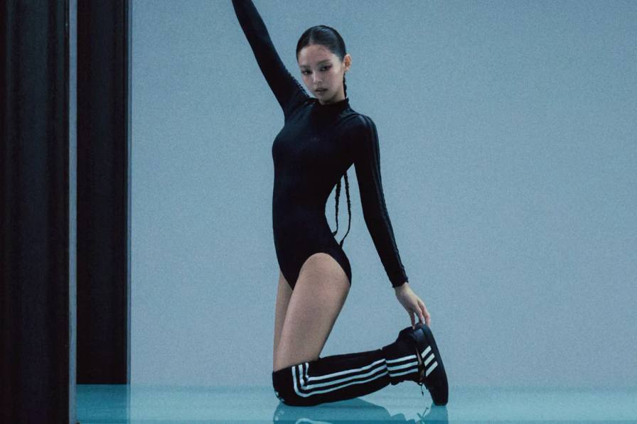 image of Jennie wearing squared-toe sneakers, wrap skirts, and sheer bodysuits from her Adidas Originals capsule line.