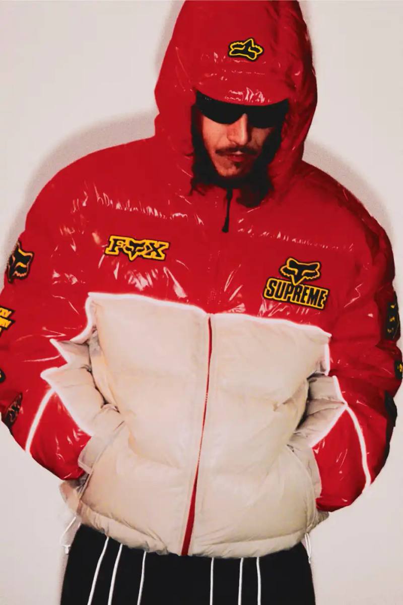 SUPREME X FOX RACING FALL 2025 DROP Supreme collaborates with Fox Racing on a Fall 2025 collection that includes motorsport gear and apparel, featuring tribute pieces to DMX with racing jerseys, helmets, and protective gear in gray camo print with red accents.