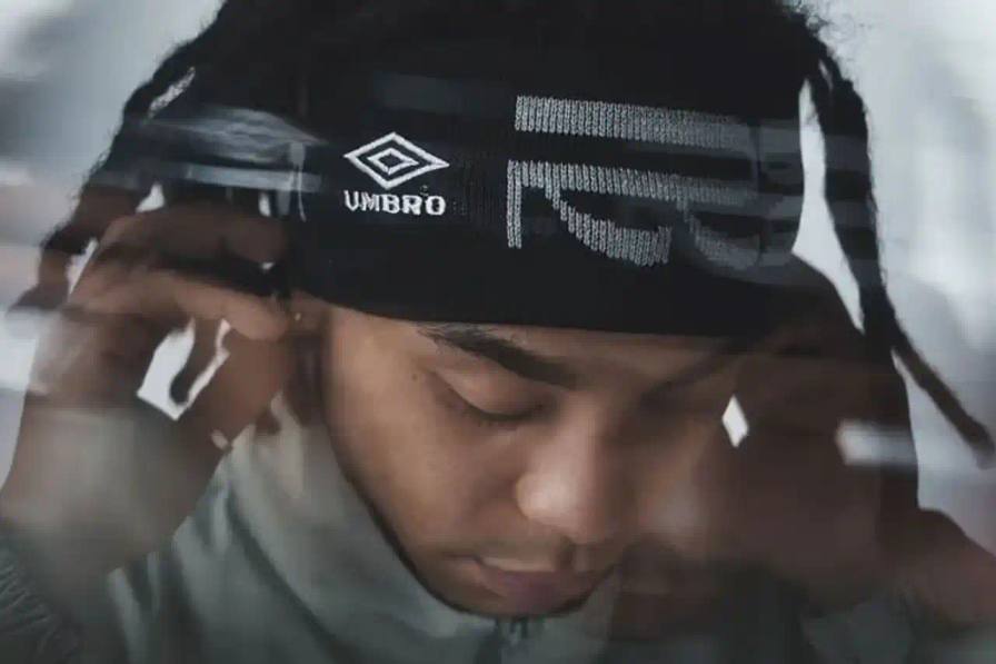 Collection items from Umbro x Rainbow Disco Club collaboration including track jackets, pants, headbands, and mesh bags.