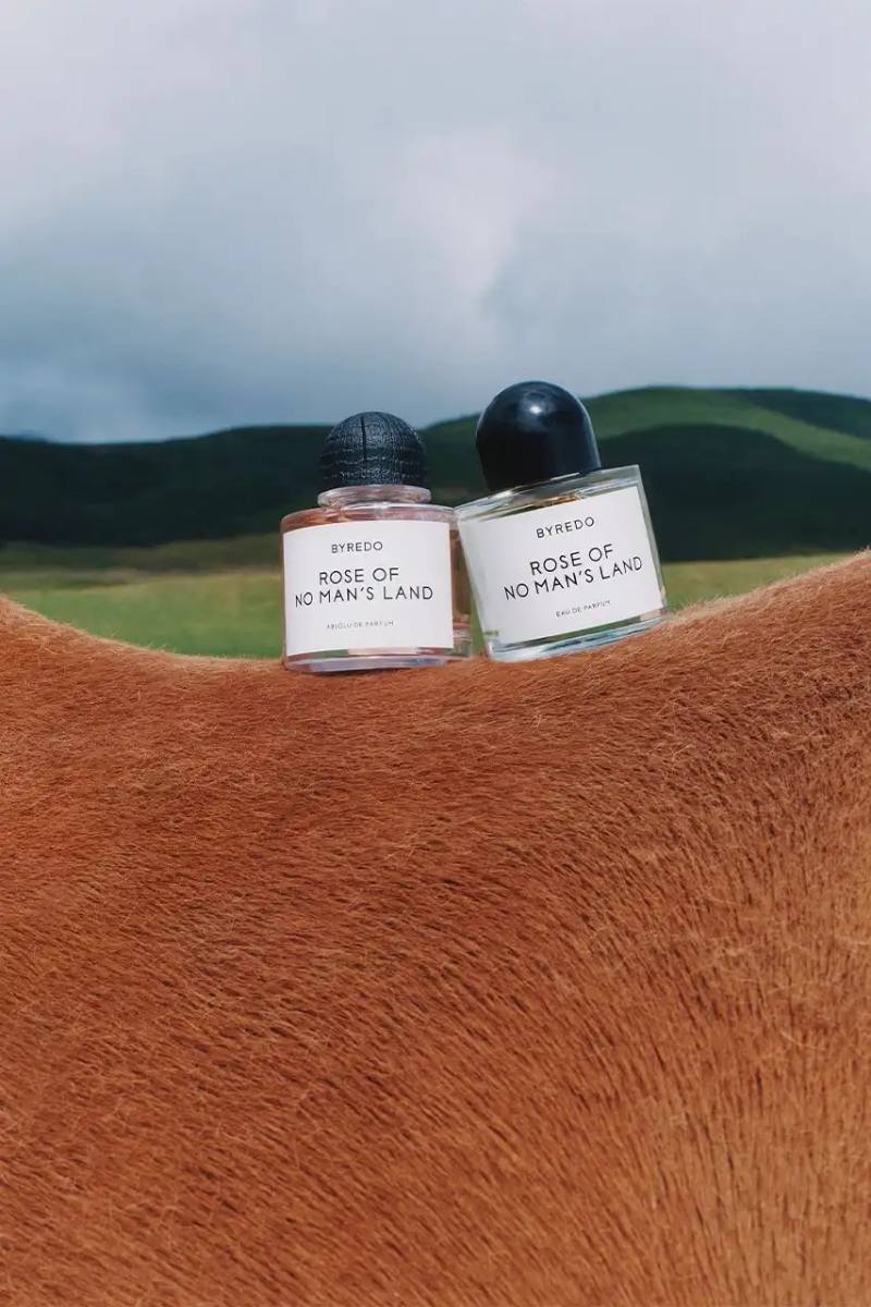 BYREDO MARKS LUNAR NEW YEAR WITH HORSE-THEMED CAMPAIGN Byredo releases Lunar New Year campaign featuring two fragrances, Rose of No Man's Land and Desert Dawn, photographed by Annie Lai with models Xi Yi and Wang Xuan in natural settings, drawing inspiration from Swedish Dala horse symbolism.