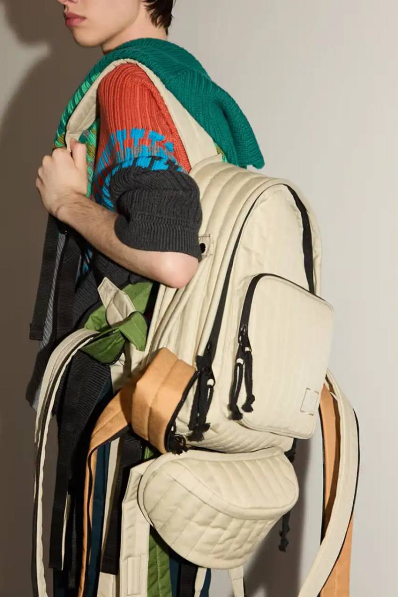 Craig Green x Eastpak collection featuring quilted bags in black, khaki and navy with distinctive vertical stitching and modified logo patches.