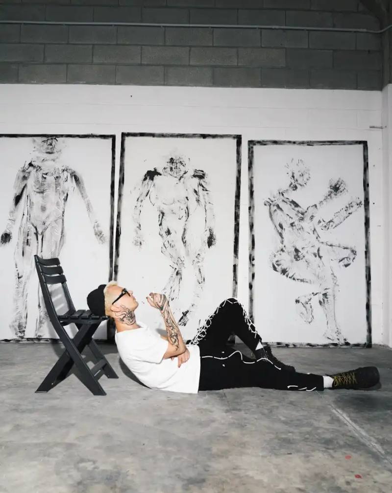 NICCOLÒ UGGIOLI: ART WOVEN FROM EMOTION photo of the Italian multidisciplinary artist Niccolò Uggioli and his upcoming solo exhibition LINES. The piece explores how Uggioli uses fabric, clothing, and performance to express deeply personal emotions, creating what he describes as "order in chaos." The article details his unconventional artistic journey from barista to artist, his collaboration with Steve Aoki, and his unique philosophy of minimalism and emotional authenticity. Uggioli's work centers on transforming everyday objects and physical experiences into meaningful artistic expressions that create visceral connections with viewers.