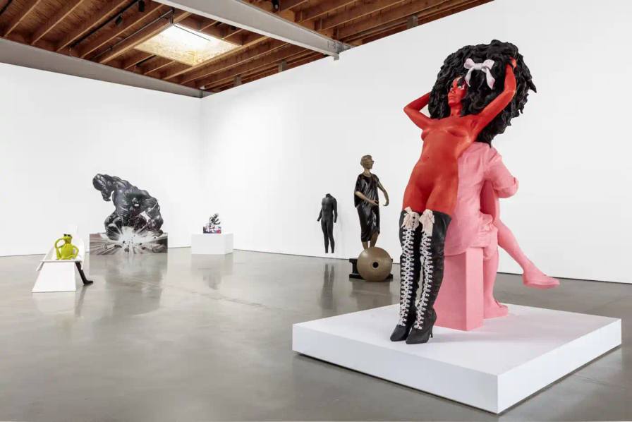 'POST HUMAN' EXHIBITION MAKES HISTORIC RETURN TO LOS ANGELES Jeffrey Deitch Los Angeles gallery exterior featuring 'Post Human' exhibition signage on white modernist building