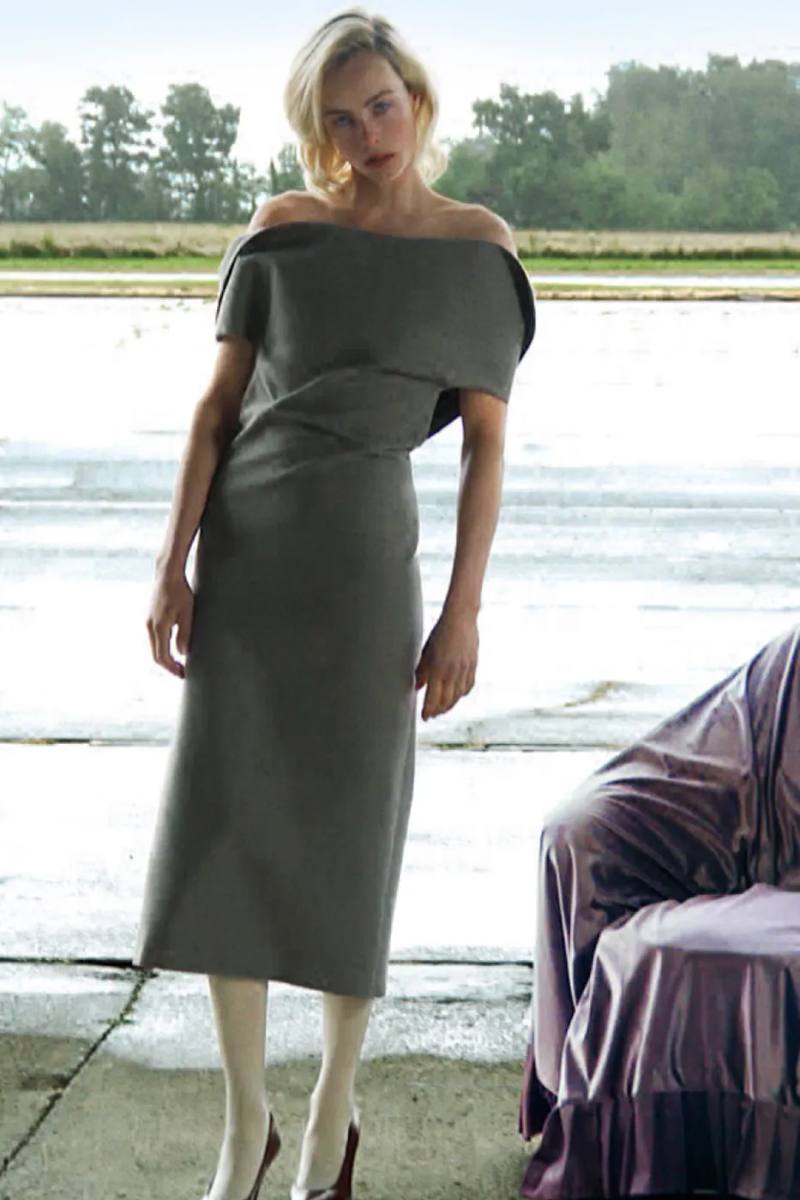 JIL SANDER FW26 CAMPAIGN REVIEW image of the Jil Sander Fall Winter 2026 campaign featuring models on an airport runway with foil and latex props. (image 1 of 3)