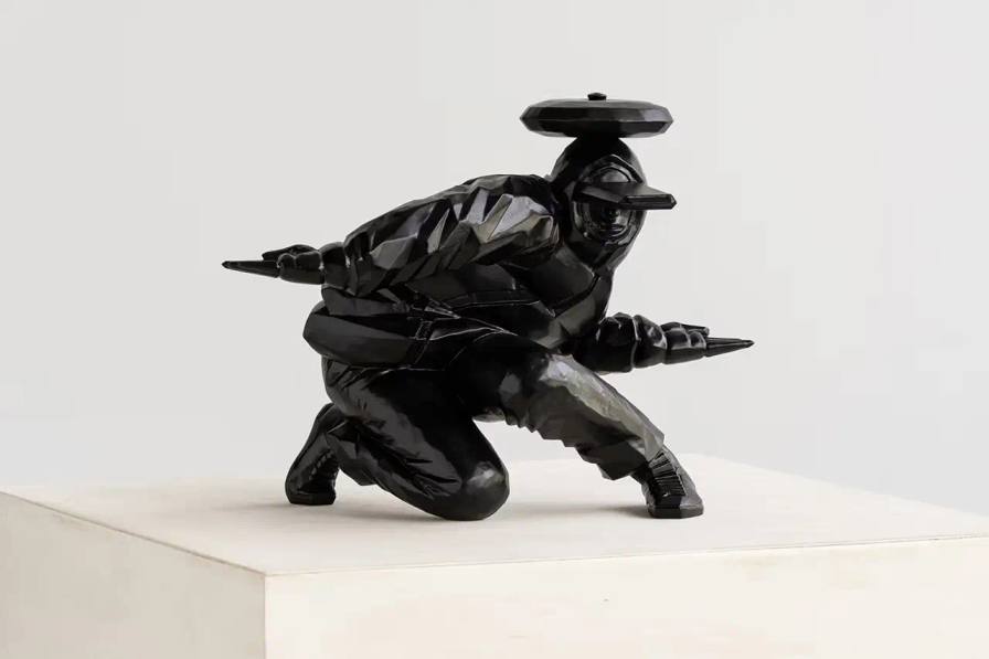 TAKU OBATA'S 'B BOY SEIDOU': WHERE BREAKDANCING MEETS BRONZE Japanese artist Taku Obata unveils ‘B BOY SEIDOU’, a limited edition bronze sculpture in collaboration with London’s Avant Arte studio. The sculpture captures the essence of breakdancing, translating dynamic street dance movements into a static yet powerful form. Obata, both an artist and breakdancer, portrays a dancer frozen mid-motion with limbs stretched outward, wearing an oversized hat. This piece marks Obata’s shift from wooden sculptures to bronze casting, featuring a matte black finish. Measuring 10.6 x 8.2 x 7.8 inches, ‘B BOY SEIDOU’ engages viewers with its outward gaze, reflecting the performative nature of breakdancing. Limited to 25 pieces, each sculpture comes with a certificate of authenticity and is priced at $6,815. The acquisition process involves a raffle system closing on October 1 at 9 am ET. Obata’s work bridges street dance and fine art, challenging artistic boundaries