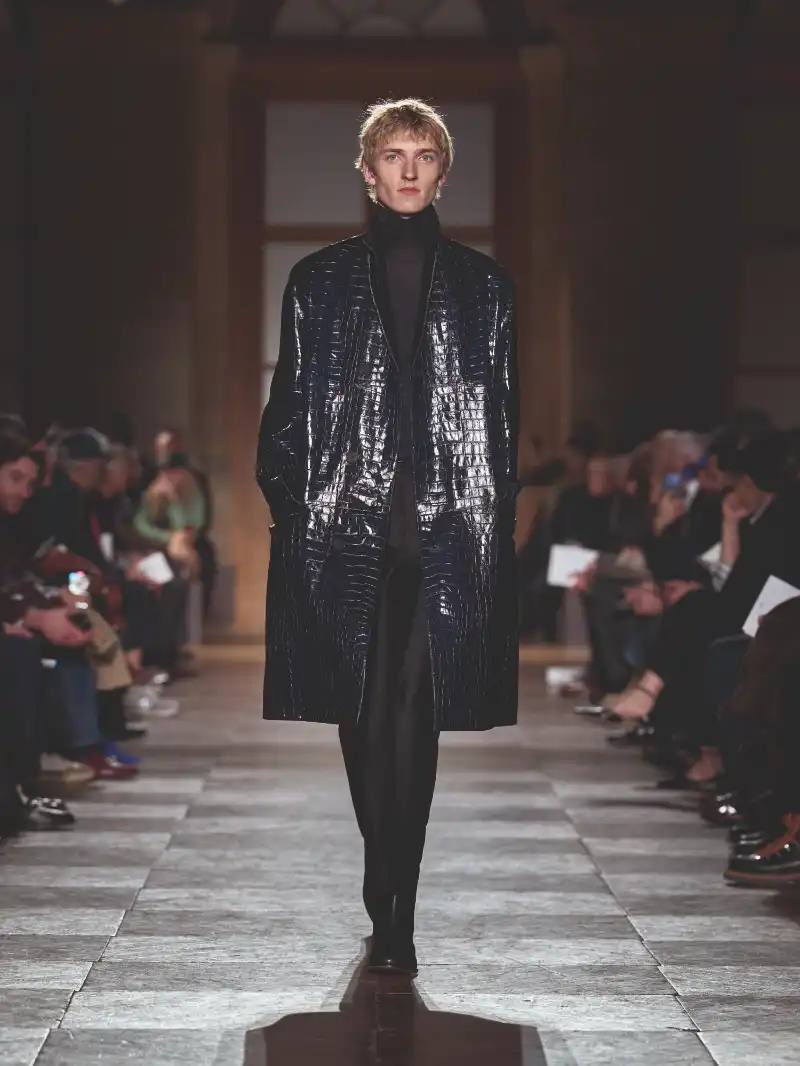HERMÈS MENSWEAR FW26 COLLECTION Article about Hermès Fall Winter 2026 menswear collection designed by Véronique Nichanian. The collection emphasizes clean construction, quality fabrics, and interior garment finishing. Color palette ranges from hemp and lichen to saffron and midnight blue. The design philosophy focuses on timeless pieces and precise craftsmanship.