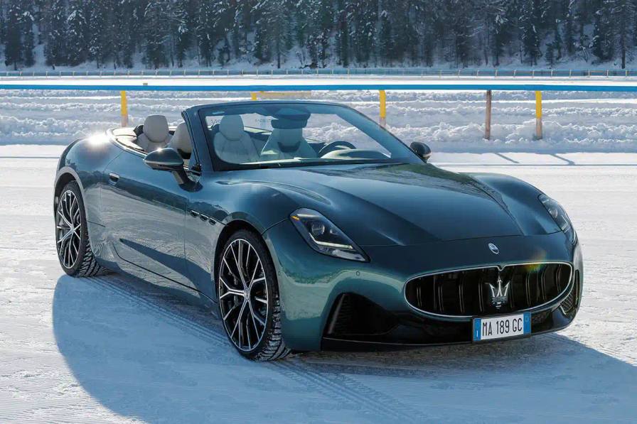 2024 Maserati GranCabrio convertible in profile view, parked on snow with Swiss Alps in background at St. Moritz