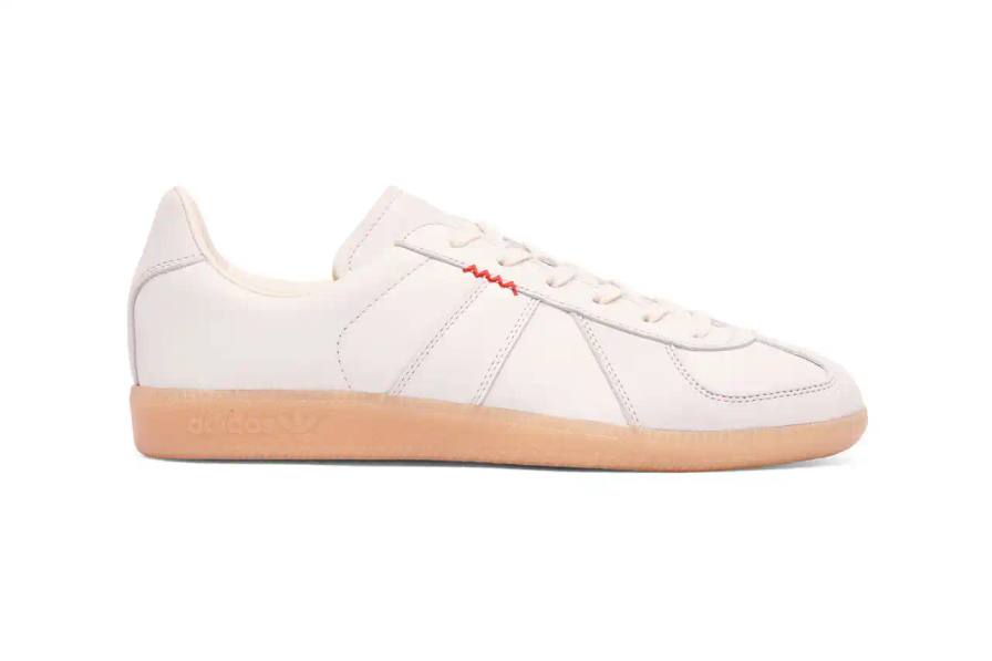 Lleumass/Timsuen/Hartcopy White leather adidas BW Army sneaker with gray nubuck panels, red embroidered line details on the sides, and gum rubber sole. Hartcopy's logo appears on the sockliner. The shoe maintains classic German Army Trainer silhouette with minimal branding.