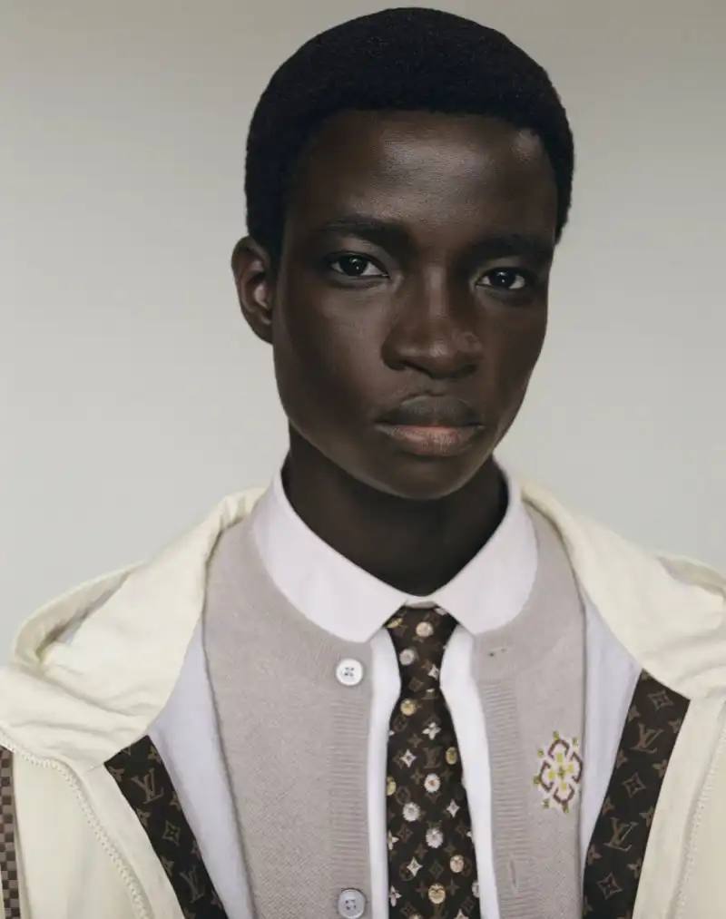 image about Pharrell Williams' new spring menswear capsule collection for Louis Vuitton featuring seasonal colors, tailoring details, and house motifs.