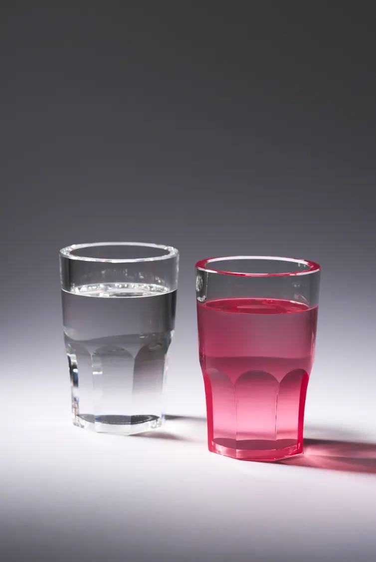 GLASS HALF FULL SCULPTURE BY THE PINK LEMONADE Article about Glass Half Full, a glass sculpture that functions as an ashtray, paper holder, or catch-all tray.
