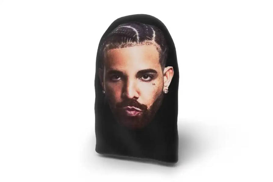 DRAKE TEAMS WITH AMAZON FOR OFFICIAL MERCH STORE imahe oDrake partners with Amazon to sell official merchandise online through a new store called The Drake Warehouse, featuring clothing, music items, and fan collectibles.