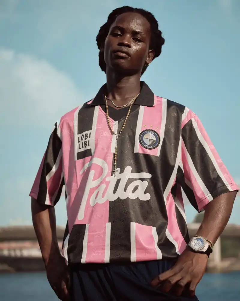 PATTA RELEASES ITS SPRING/SUMMER 2026 COLLECTION Patta's Spring/Summer 2026 collection includes football jerseys, denim, tracksuits, and leather pieces in sand, sports blue, pine green, black, and brown colorways with fuchsia accents.