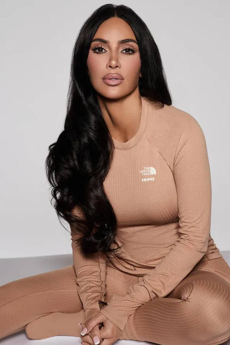 Kim Kardashian wearing SKIMS x The North Face Dot Knit Top and Bottom in neutral earth tones, photographed by Donna Trope against a minimalist background
