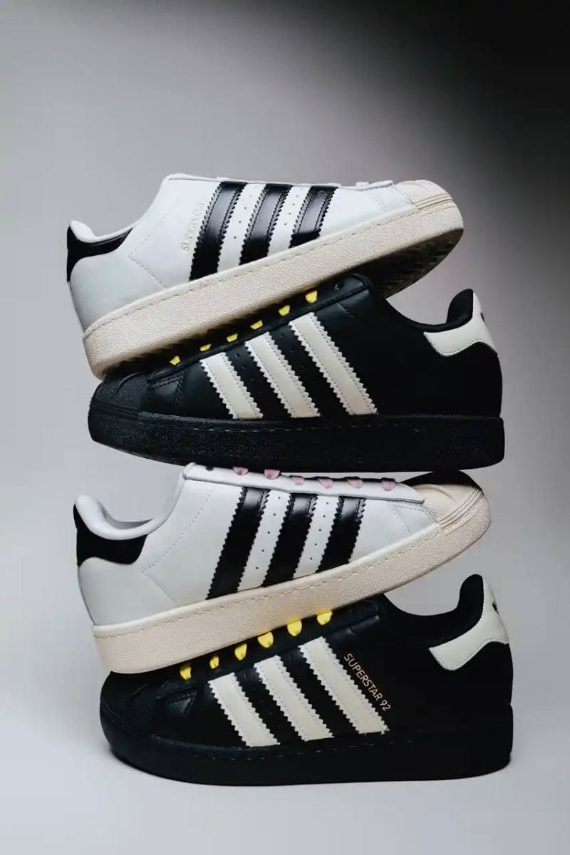 The Pharrell x adidas Virginia Superstar 92 sneaker in Off White colorway, showing its oversized silhouette with thick padding and classic shell toe design against a neutral background.