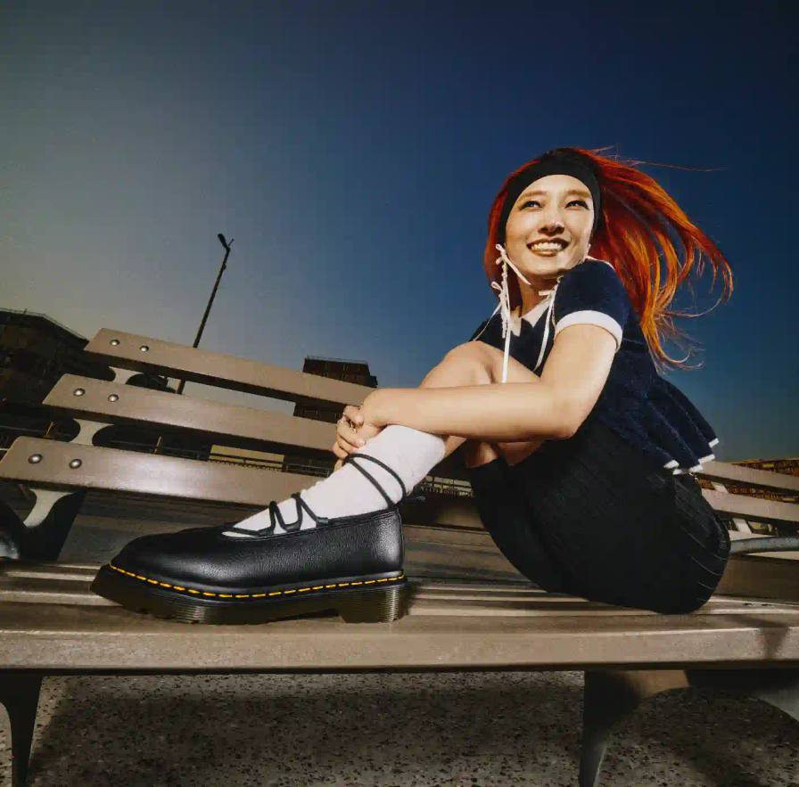 Dr. Martens Buzz shoe with 5-eyelet design and platform sole, shown in leopard-print Hair On leather with black laces and distinctive chunky base.