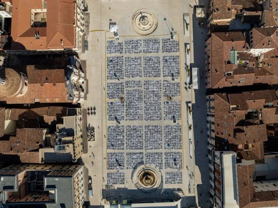 JR INSIDE OUT PROJECT LAUNCHES IN L'AQUILA, ITALY An article outlining a large-scale outdoor photography installation in an Italian public square by JR in L'Aquilia, Italy, photography by Andrea Mancini