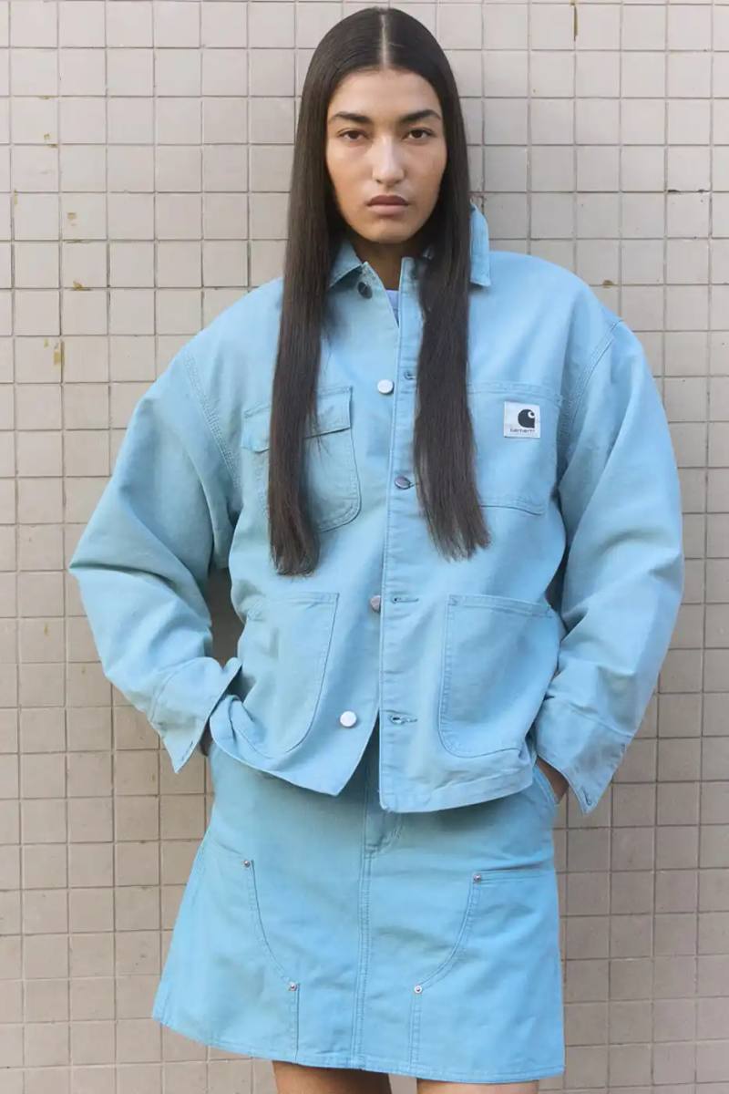 Carhartt WIP's Spring/Summer 2026 Icons collection features updated versions of classic workwear pieces like the Michigan Coat and Detroit Jacket in new colors including dusky turquoise, green, and mauve, along with new silhouettes like the Clapton Jacket and Women's Clark Jacket.