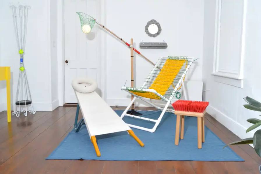 Interior design exhibition featuring furniture and objects made from repurposed hardware store materials