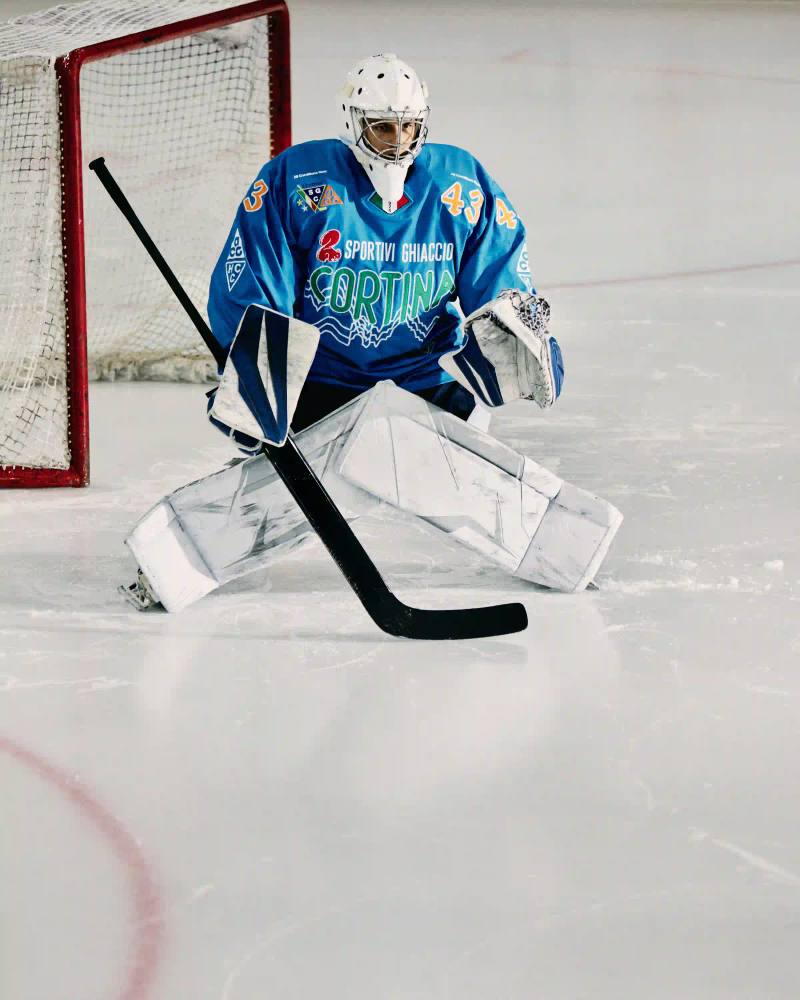 NIKE ACG AND SG CORTINA DEBUT MOUNTAIN-INSPIRED HOCKEY JERSEY image describes collaboration between Nike ACG and SG Cortina hockey team on special edition jersey. Design features Dolomite mountain silhouettes. Jersey worn once during December 7 match at Olympic Ice Stadium in Cortina d'Ampezzo. Limited quantities available at Acqua Salata store starting December 8.