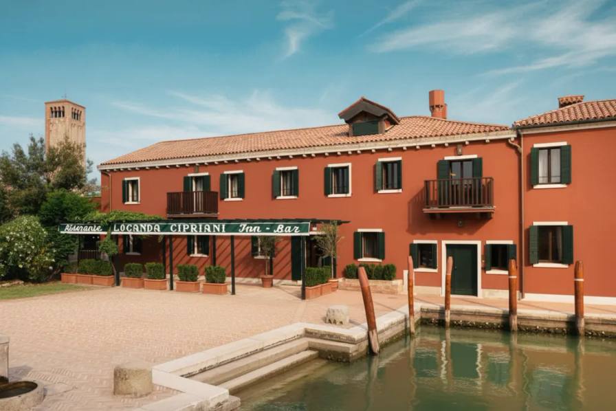 image detailing the reopening, architectural layout, rooms, suites, culinary options, and historical background of Locanda Cipriani.