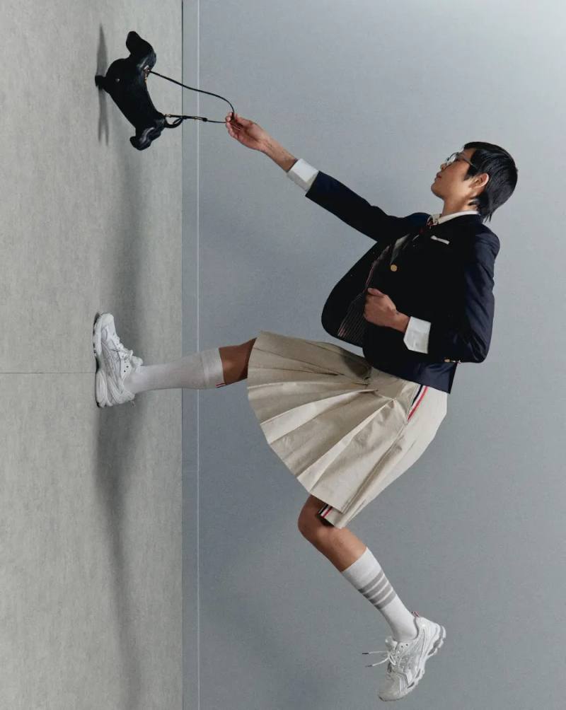 image describing the Thom Browne x ASICS GEL-KAYANO 14 collaboration, covering design details, materials, availability, and background on both brands.