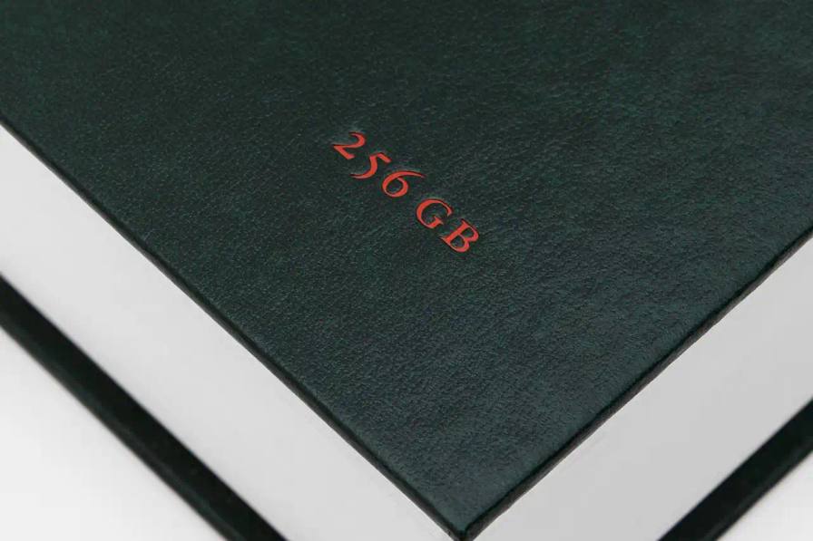 image about musician Yung Lean's first book publication, containing ten years of personal iPhone content organized into themed chapters. The piece describes the book's physical design, content organization, and the artist's reflection on digital memory collection.
