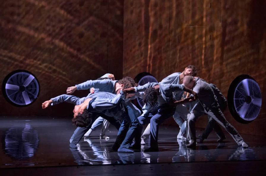 Dancers in Zephyr by Mourad Merzouki leaning into resistance on stage at 13eme Art Paris
