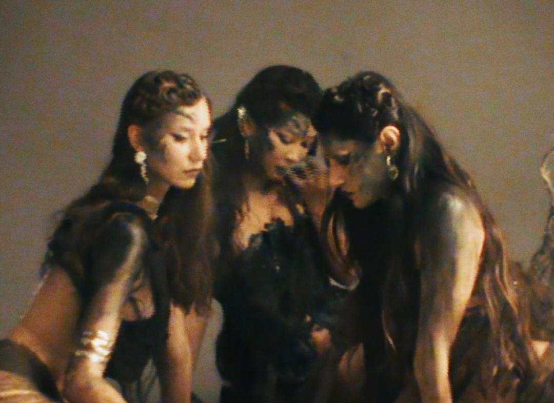 Profile of fashion designer Luna Manjetsu and her brand Taste of Moon. Manjetsu creates clothing from recycled materials, viewing fashion as personal healing and collective empowerment. Born under a full moon in Taiwan, she draws from experiences with domestic violence to design pieces that celebrate vulnerability and resilience. Her work blends spirituality with sustainability, creating garments she describes as rituals. The interview covers her creative process, use of waste materials, theatrical influences, and vision for authentic fashion outside traditional industry systems.