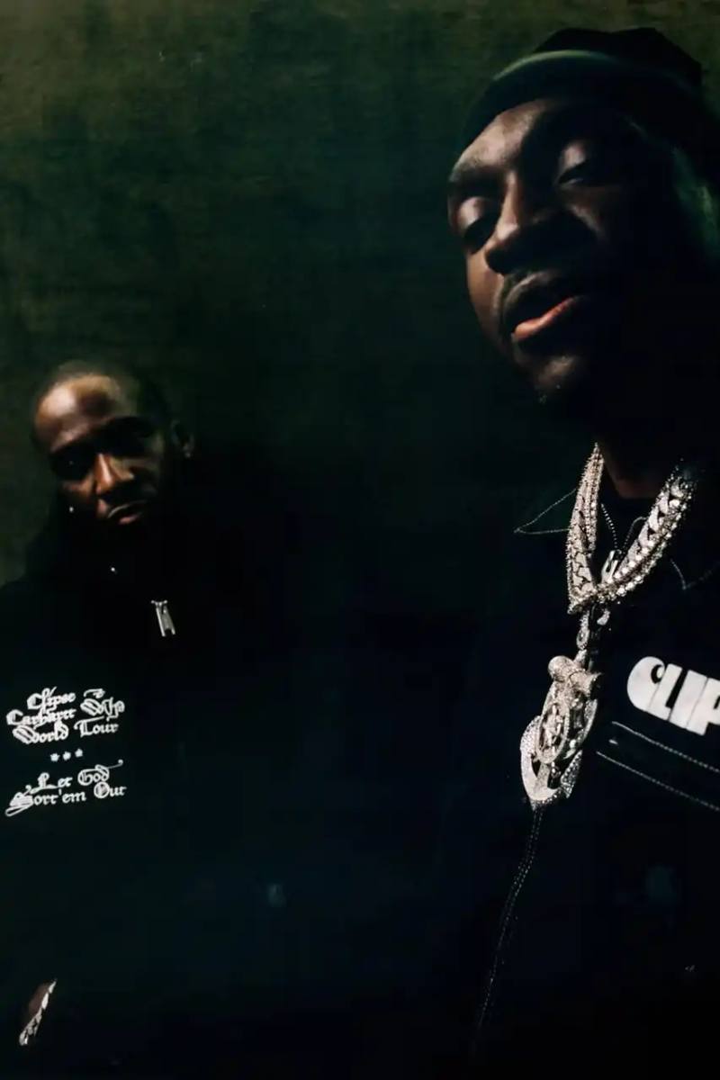 image about hip-hop duo Clipse's return to music after 16-year hiatus, featuring details about their collaboration with Carhartt WIP for a clothing collection that launches alongside their new album "Let God Sort Em Out."