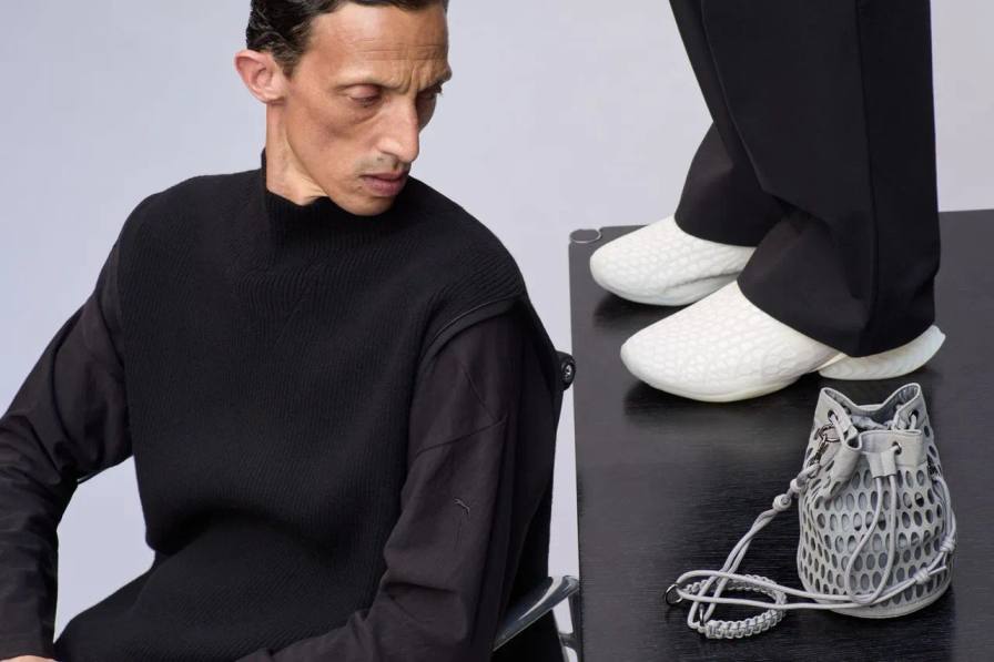image of the PUMA and J.L-A.L Fall 2026 collection focusing on the new CELL Geo sneaker design and accompanying black technical apparel.