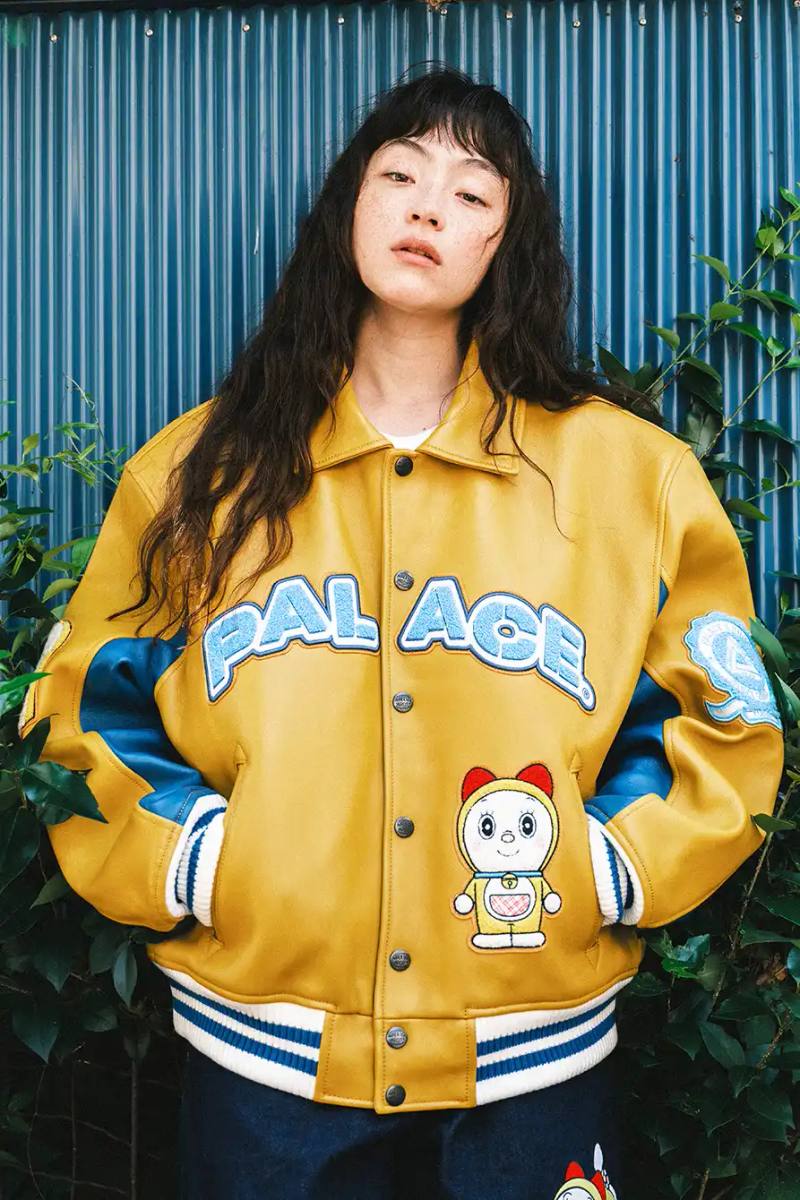 PALACE X DORAEMON COLLECTION DROPS FALL 2025 image of Palace streetwear brand collaborates with Japanese anime character Doraemon on clothing collection including jackets, shirts, and accessories.