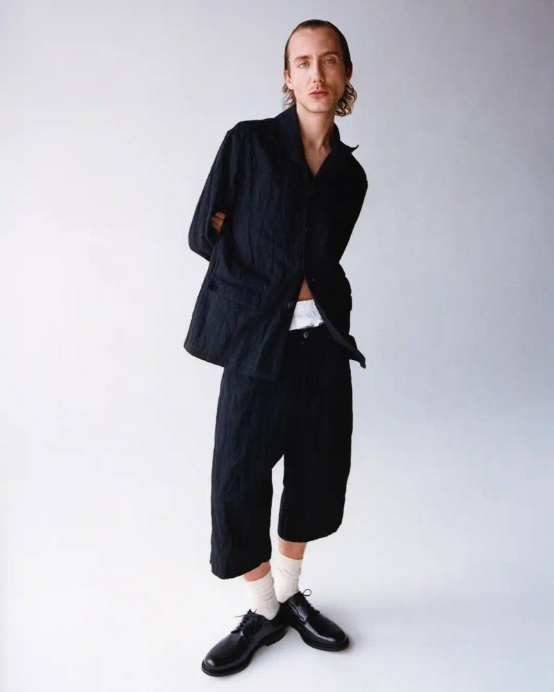 STILL KELLY DROPS SECOND COLLECTION image about Still Kelly's second menswear collection by Marc Kalman, featuring 37 pieces including workwear, denim, and graphic tees with punk and pop influences.