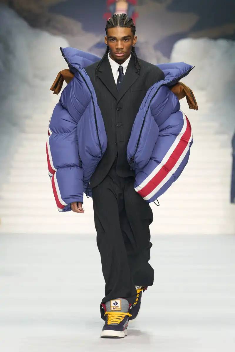 DSQUARED2 FALL/WINTER 2026 MENSWEAR DSQUARED2 Fall/Winter 2026 menswear collection at Milan Fashion Week features ski slope aesthetics, oversized puffers, technical sportswear, and Canadian-inspired designs with emphasis on layering and attitude.