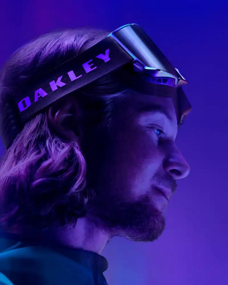 Oakley introduces the Aura collection featuring eyewear, helmets, and accessories with color-changing paint in purple, green, red, and gold gradients.