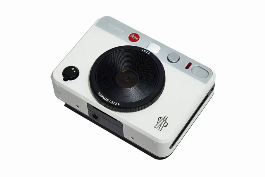 Limited edition white Leica camera featuring Moncler logo on front and FW25 Courchevel runway inscription on top, created exclusively for Moncler Grenoble's alpine fashion show guests.