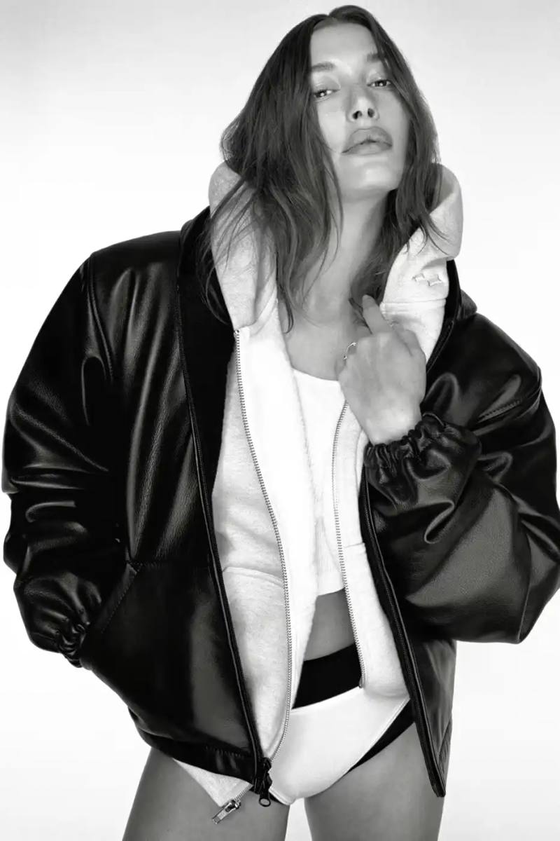 JUSTIN BIEBER SKYLRK LABEL DROPS HAILEY BIEBER CAPSULE image on the release of Justin Bieber's fashion brand SKYLRK's new collection, describing the clothing items, the campaign featuring Hailey Bieber, and the release details.