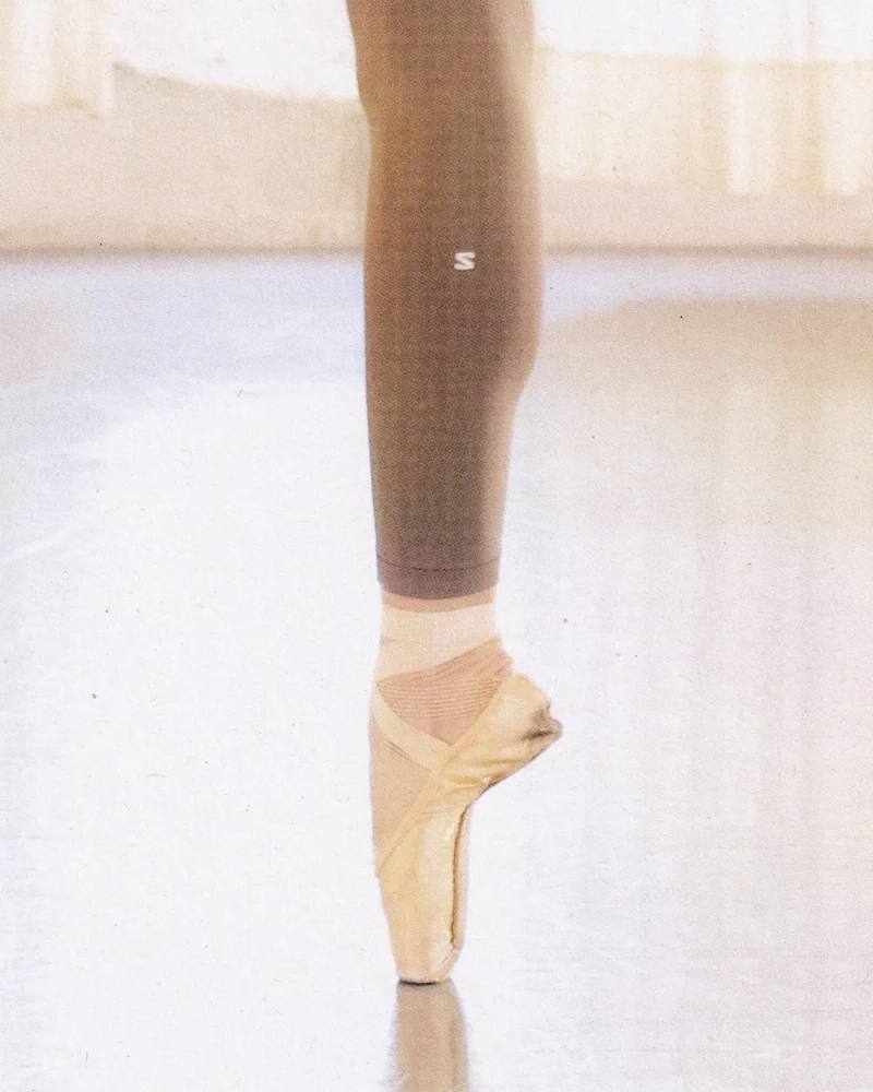 an image detailing the three-year partnership between French outdoor brand Salomon and the Paris Opera Ballet to supply athletic gear for dancers.