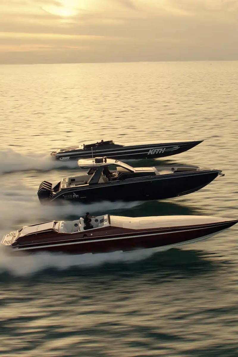 image about the collaboration between fashion brand Kith and boat manufacturer Cigarette Racing. It describes three custom luxury powerboats (the 515, 42' X, and 42' Auroris) with unique design features including custom paint jobs, branded interiors, and integrated technology systems. The article mentions the boats will be available made-to-order beginning May 16 with prices starting at $1.6 million, and that Kith has also created an accompanying apparel collection.