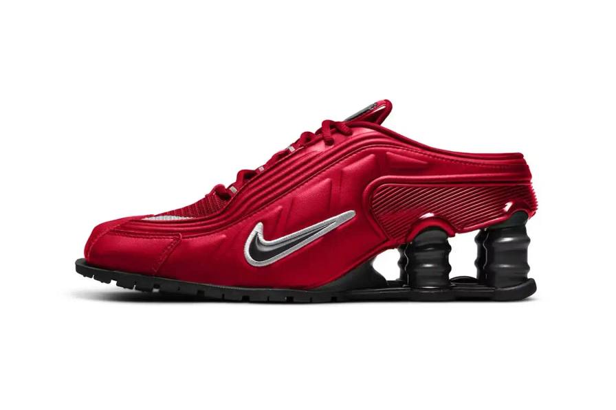 The Martine Rose x Nike Shox MR4 sneaker in two colorways. The left shoe shows the Fire Red version with a bright red synthetic leather upper, black accents, and silver Shox columns. The right shoe displays the Metallic Platinum colorway featuring a silver-toned upper with red highlights and white base. Both shoes showcase the distinctive elongated pointed toe and exaggerated heel structure characteristic of the MR4 design.
