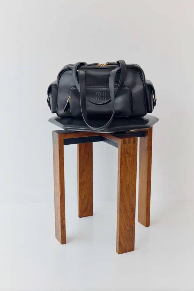 image about Miu Miu's expanded Pocket Bag collection, detailing the various styles, materials, and design features of bags characterized by functional exterior pockets originally introduced in the brand's Spring/Summer 2023 runway show.