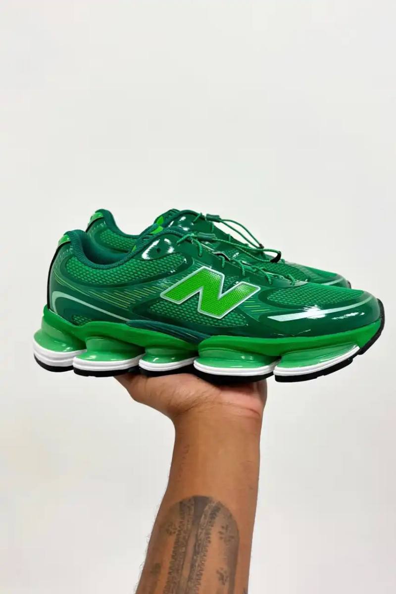 image about rapper Aminé's upcoming New Balance sneaker collaboration featuring acid green colorway and special library-themed packaging.